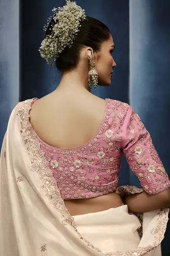 Cream fancy fabric embroidered saree with stiched blouse