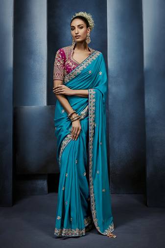 Aqua blue fancy fabric embroidered saree with stiched blouse