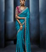 Aqua blue fancy fabric embroidered saree with stiched blouse