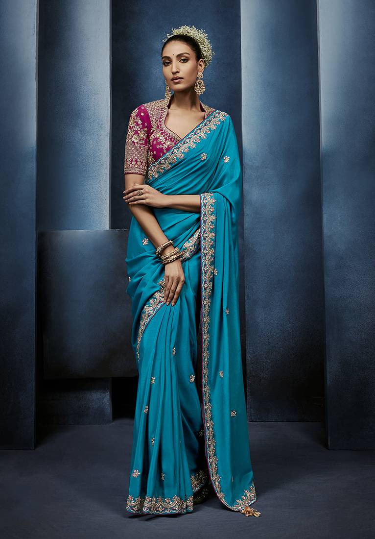 Aqua blue fancy fabric embroidered saree with stiched blouse