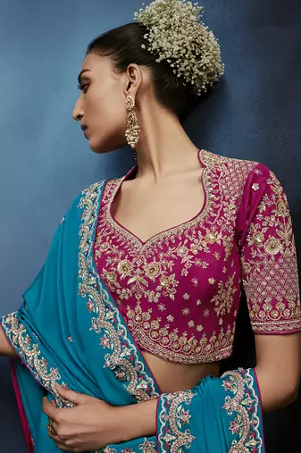 Aqua blue fancy fabric embroidered saree with stiched blouse