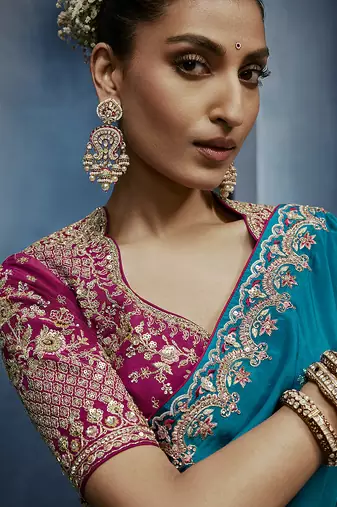 Aqua blue fancy fabric embroidered saree with stiched blouse