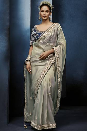 Light grey fancy fabric embroidered saree with stiched blouse