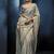 Light grey fancy fabric embroidered saree with stiched blouse