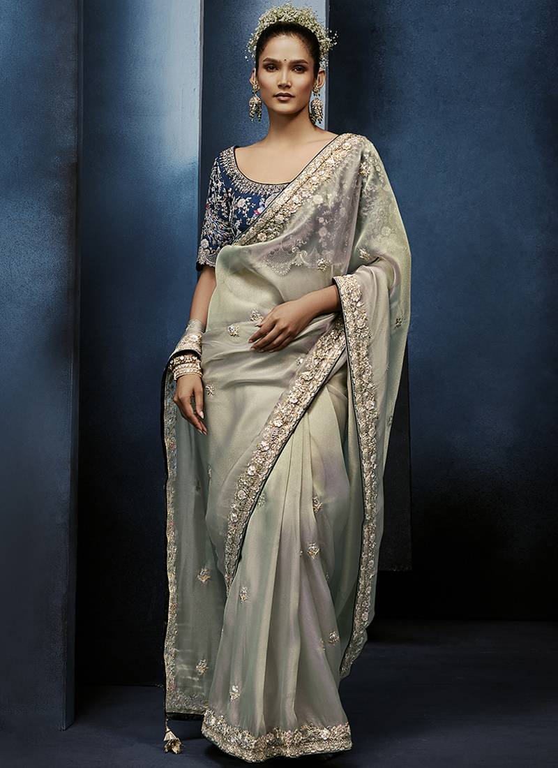 Light grey fancy fabric embroidered saree with stiched blouse