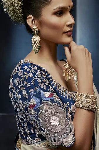 Light grey fancy fabric embroidered saree with stiched blouse