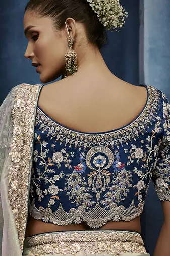 Light grey fancy fabric embroidered saree with stiched blouse