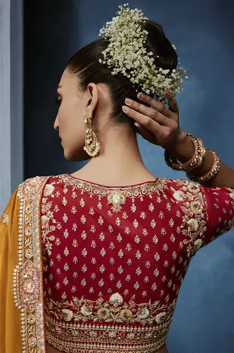 Orange fancy fabric embroidered saree with stiched blouse
