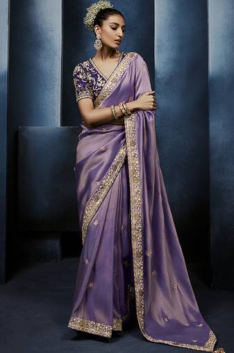 Lavender fancy fabric embroidered saree with stiched blouse