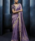 Lavender fancy fabric embroidered saree with stiched blouse
