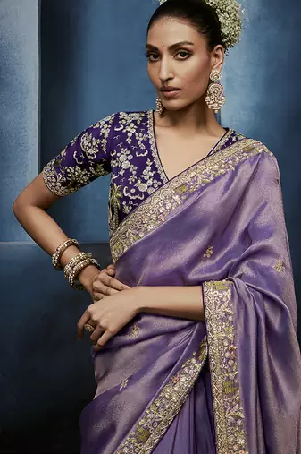 Lavender fancy fabric embroidered saree with stiched blouse