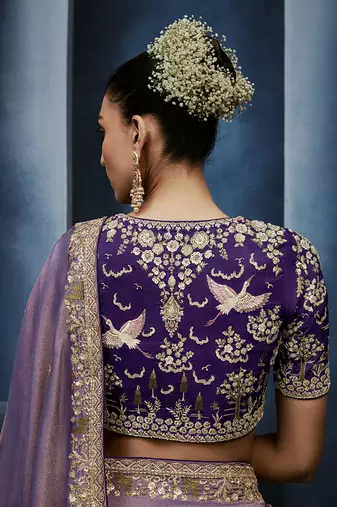 Lavender fancy fabric embroidered saree with stiched blouse