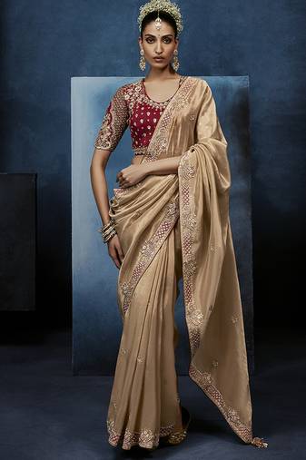 Beige fancy fabric embroidered saree with stiched blouse