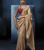 Beige fancy fabric embroidered saree with stiched blouse
