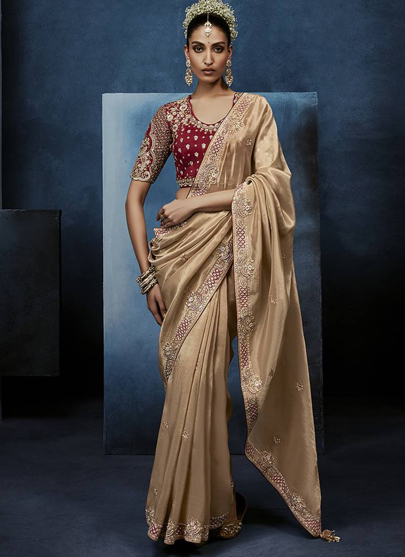 Beige fancy fabric embroidered saree with stiched blouse