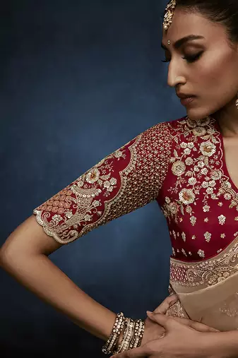 Beige fancy fabric embroidered saree with stiched blouse