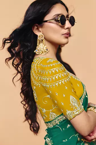 Teal green faux organza satin saree with embroidery