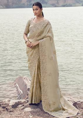 Beige embroidered woven faux tissue silk blend saree 1