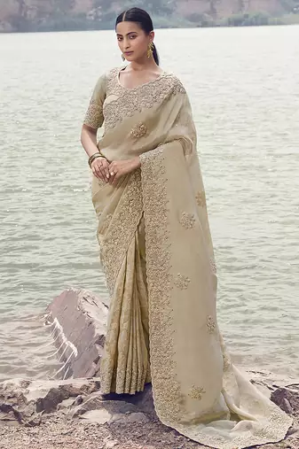 Beige embroidered woven faux tissue silk blend saree
