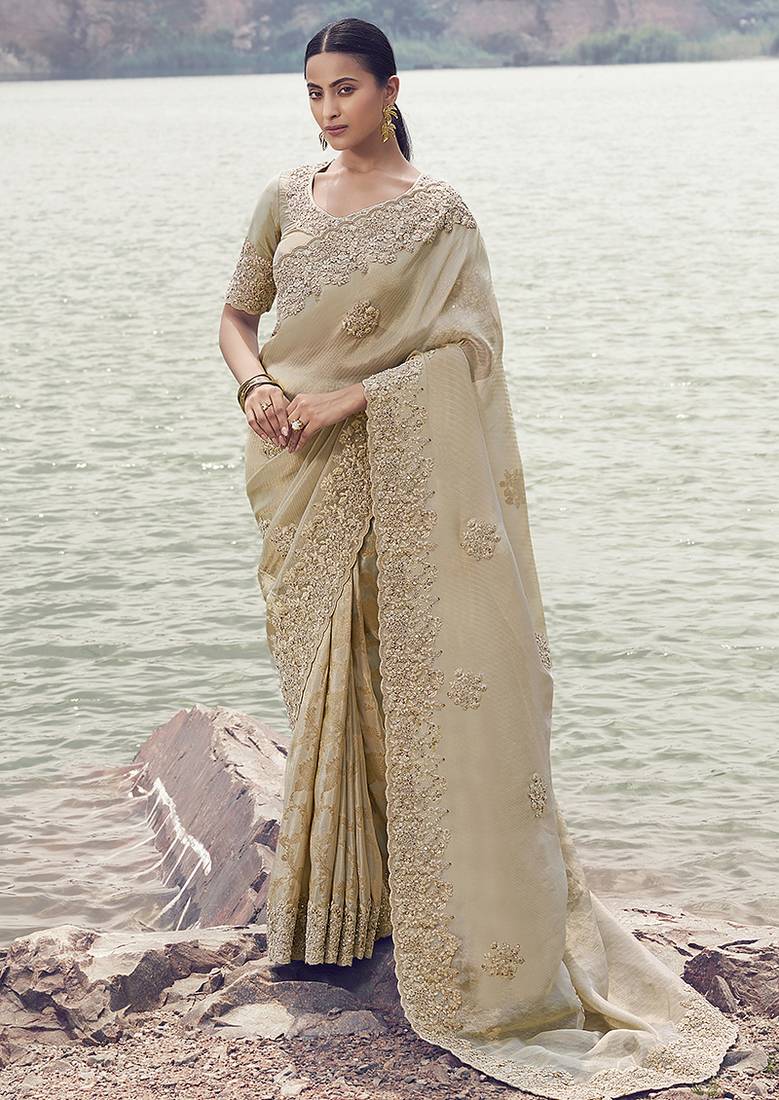 Beige embroidered woven faux tissue silk blend saree