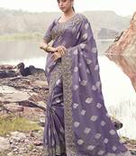 Lavender purple embroidered woven faux tissue silk blend saree