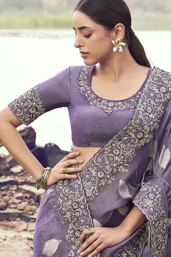 Lavender purple embroidered woven faux tissue silk blend saree