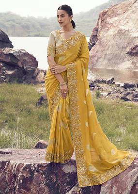 Yellow embroidered woven faux tissue silk blend saree 1