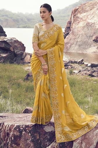Yellow embroidered woven faux tissue silk blend saree