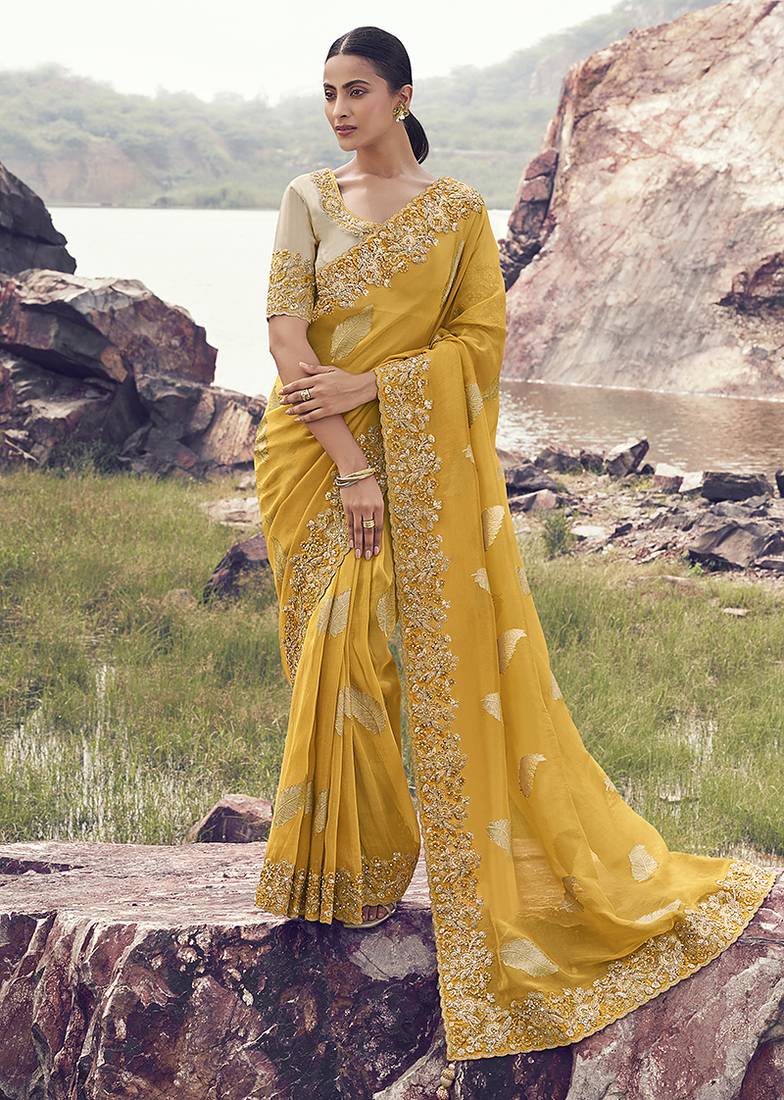 Yellow embroidered woven faux tissue silk blend saree