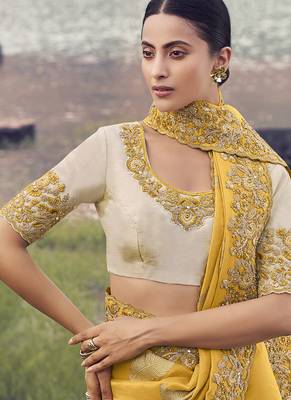 Yellow embroidered woven faux tissue silk blend saree 2