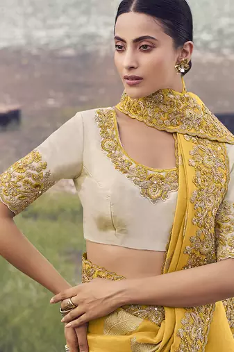 Yellow embroidered woven faux tissue silk blend saree