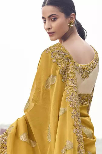 Yellow embroidered woven faux tissue silk blend saree