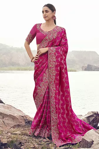 Rani pink embroidered woven satin silk blend saree