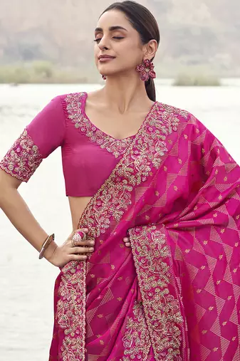 Rani pink embroidered woven satin silk blend saree