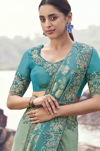 Sea greeen & aqua blue embroidered woven faux tissue silk blend saree