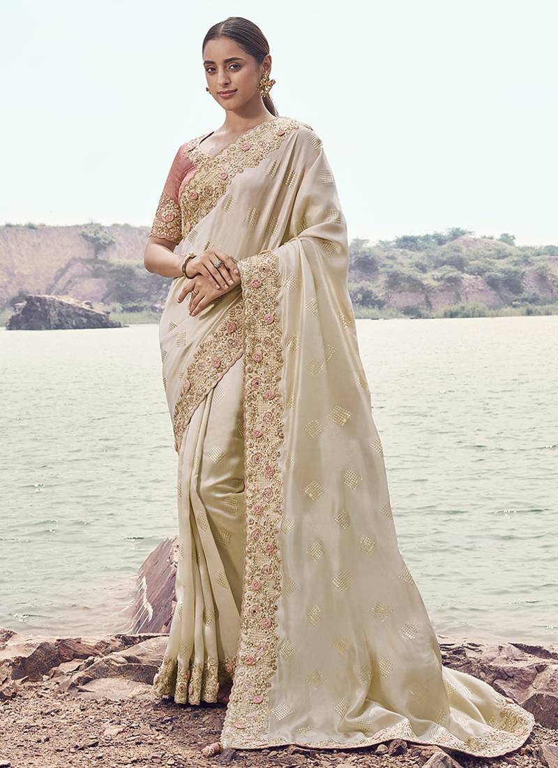 Off white embroidered satin silk blend saree
