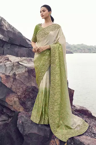 Beige & green embroidered woven faux tissue silk blend saree