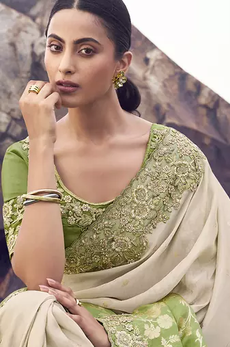 Beige & green embroidered woven faux tissue silk blend saree