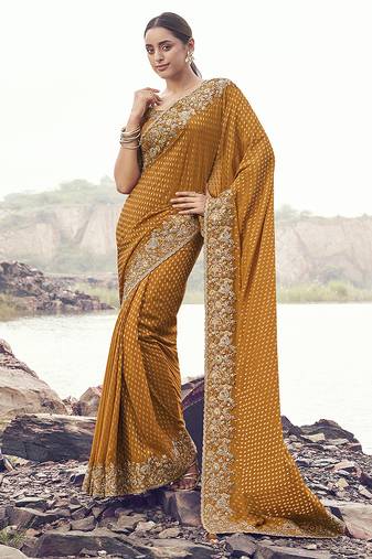 Rust orange embroidered woven satin silk blend saree