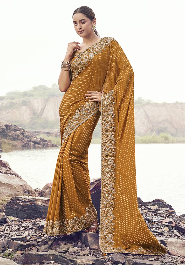 Rust orange embroidered woven satin silk blend saree