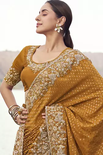 Rust orange embroidered woven satin silk blend saree