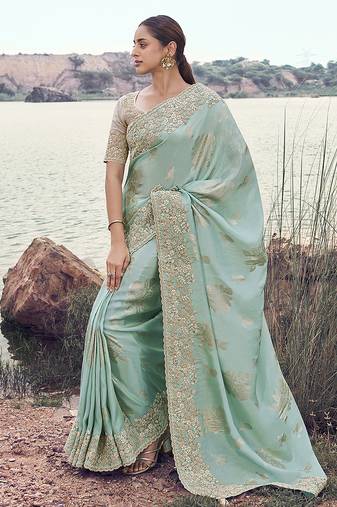 Light sky blue embroidered woven faux tissue silk blend saree