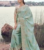 Light sky blue embroidered woven faux tissue silk blend saree