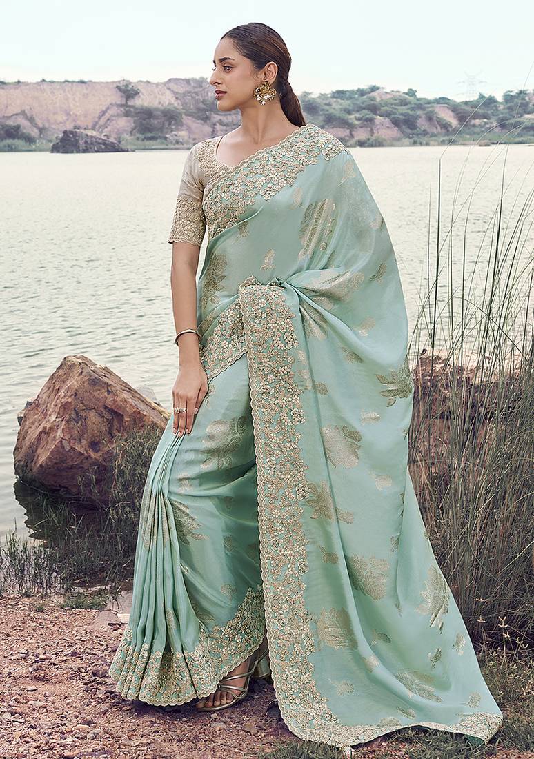 Light sky blue embroidered woven faux tissue silk blend saree