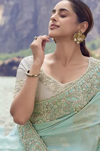 Light sky blue embroidered woven faux tissue silk blend saree