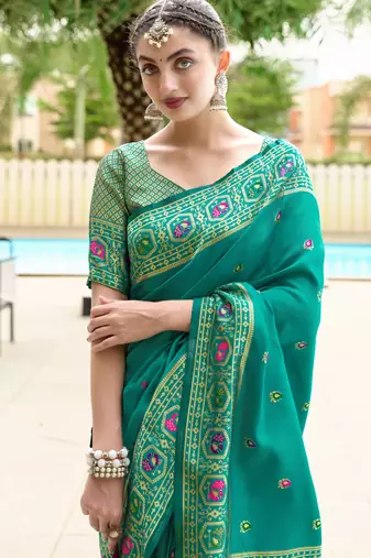 Teal green silk blend banarasi saree with unstitched blouse piece