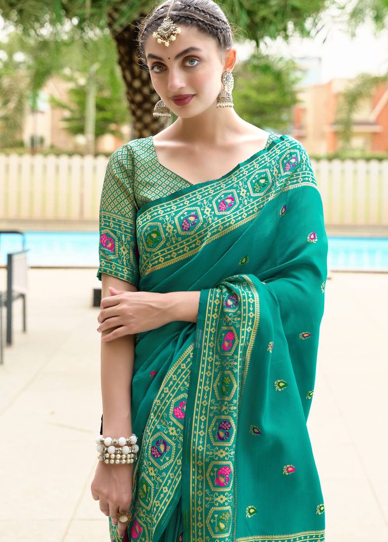 Teal green soft silk blend banarasi jacuard work designer party wear saree with unstitched blouse piece