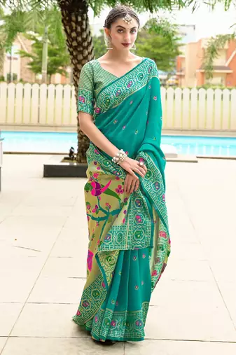 Teal green silk blend banarasi saree with unstitched blouse piece