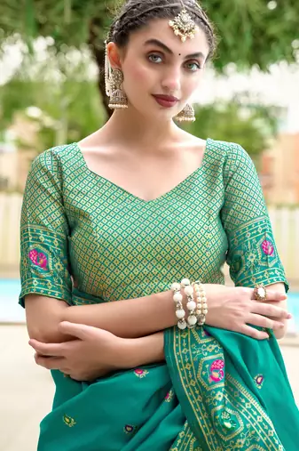 Teal green silk blend banarasi saree with unstitched blouse piece