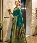 Teal green silk blend banarasi saree with unstitched blouse piece